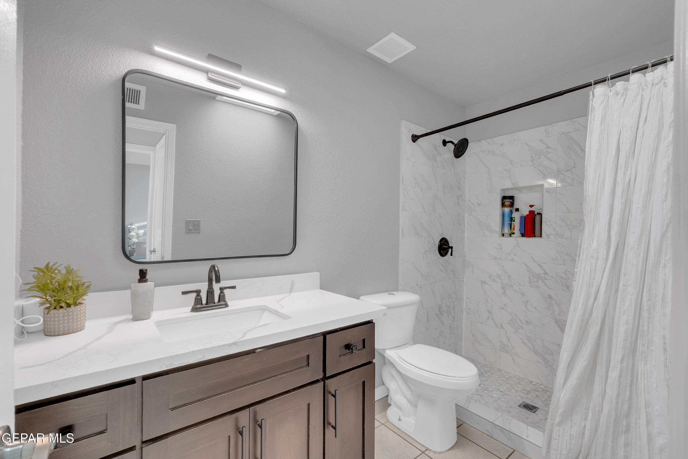 3444 Itasca Street El Paso, TX 79936 - Photo 39 of 88 a bathroom with a sink vanity mirror and toilet