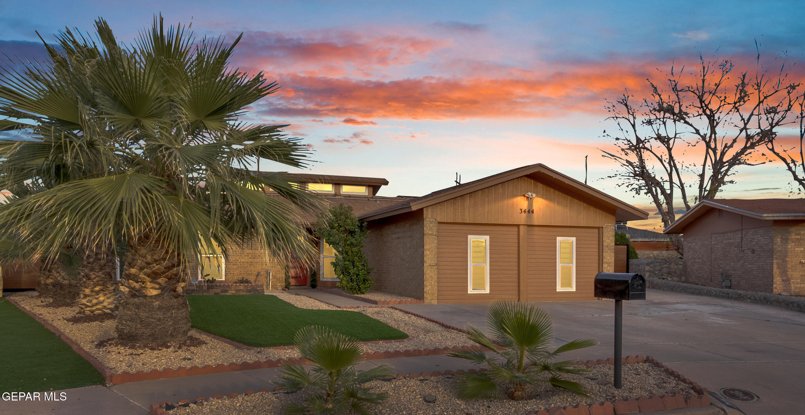 3444 Itasca Street El Paso, TX 79936 - Photo 4 of 88 a front view of a house with a garden