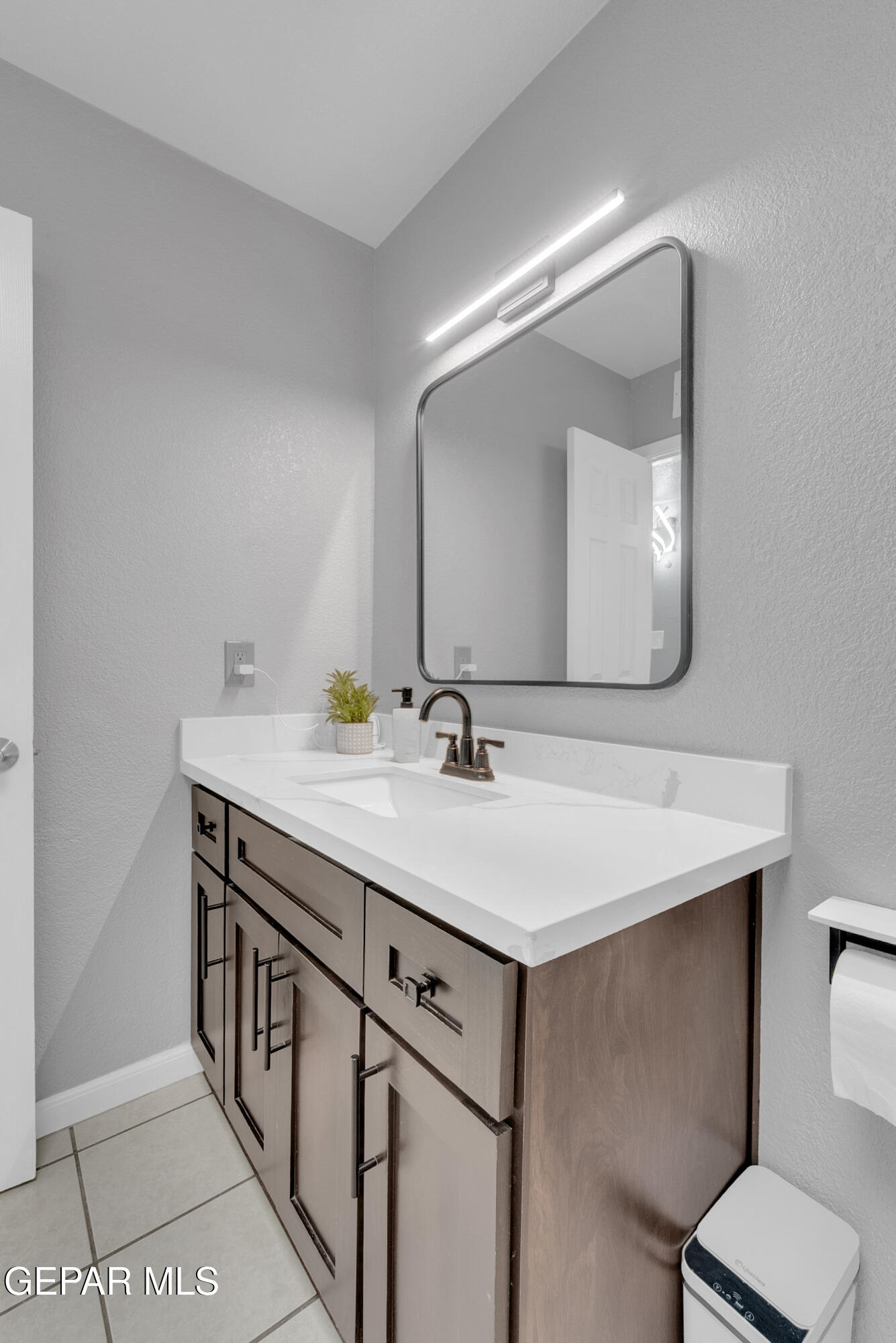 3444 Itasca Street El Paso, TX 79936 - Photo 41 of 88 a bathroom with a sink a toilet and mirror
