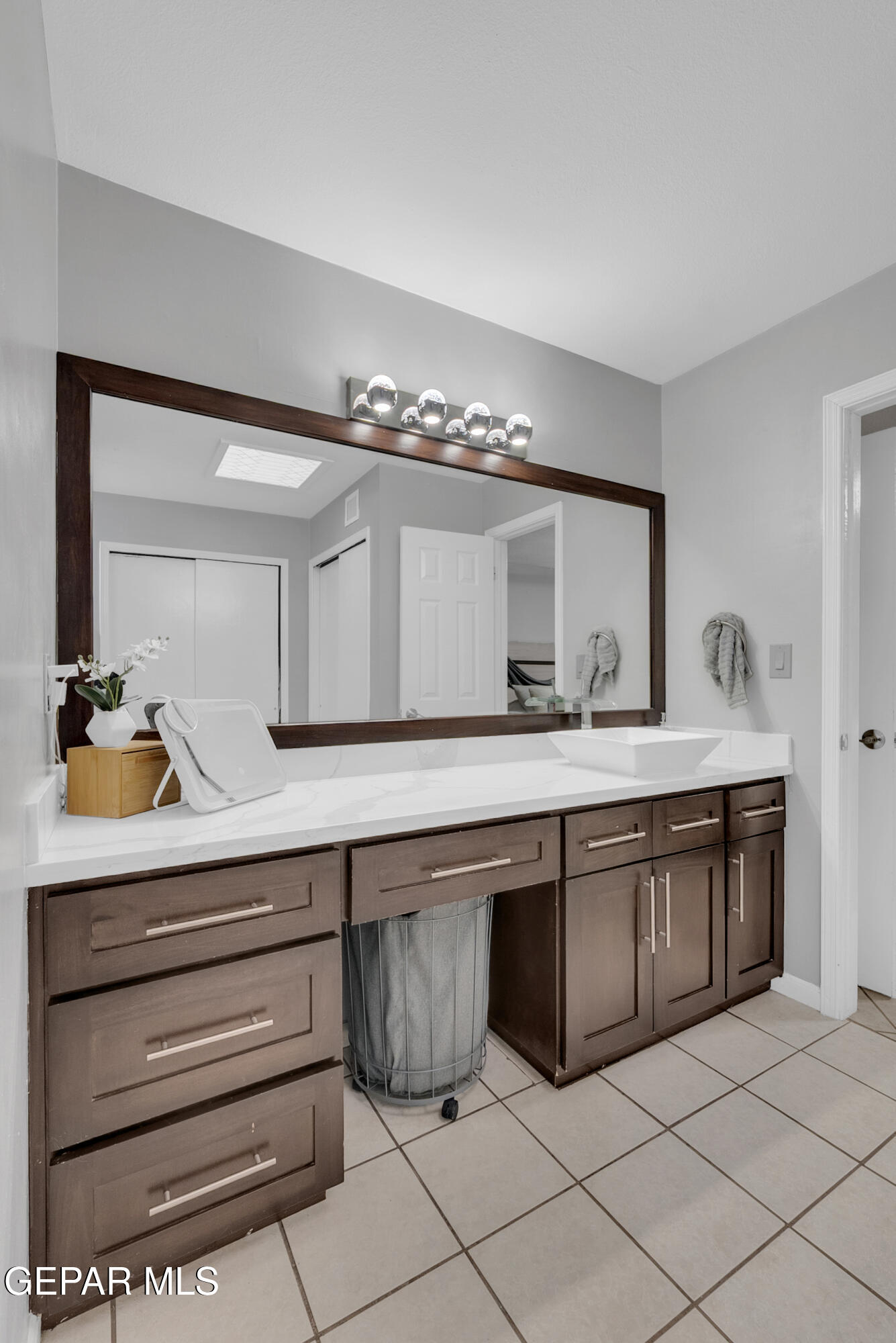 3444 Itasca Street El Paso, TX 79936 - Photo 49 of 88 a spacious bathroom with a double vanity sink and a mirror