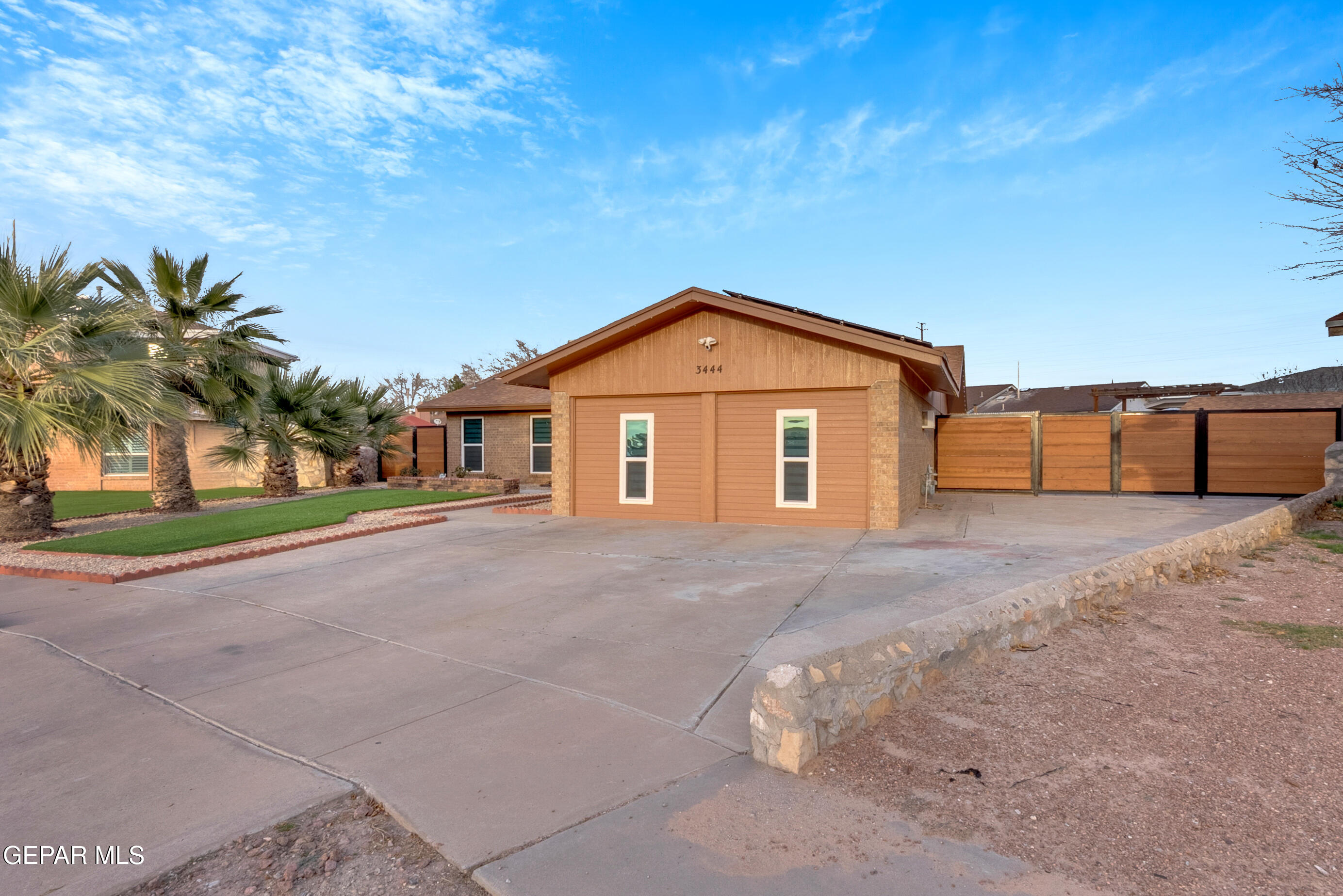 3444 Itasca Street El Paso, TX 79936 - Photo 5 of 88 a front view of a house with a yard and garage