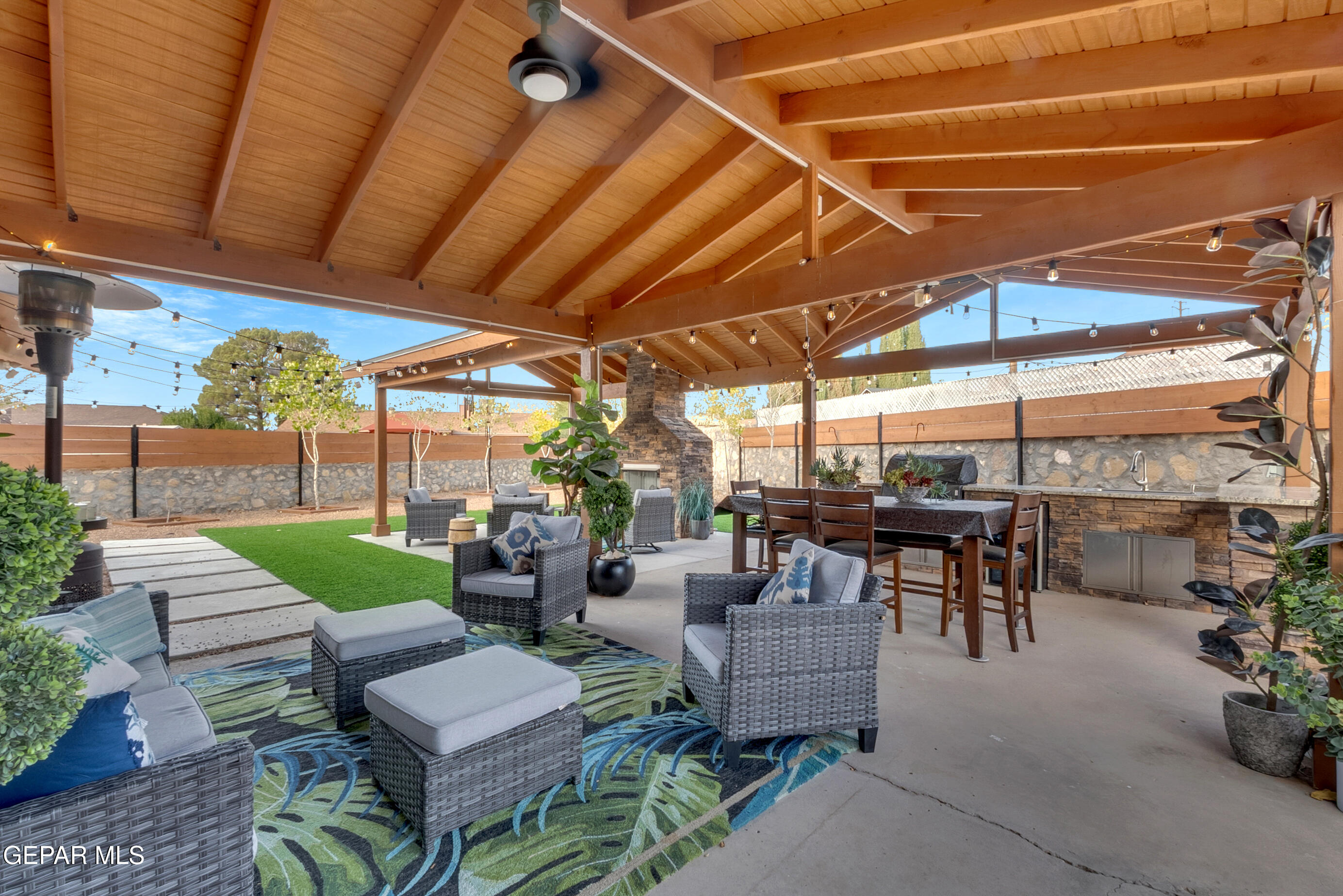 3444 Itasca Street El Paso, TX 79936 - Photo 54 of 88 a view of a patio with couches and a table and chairs with wooden floor