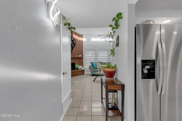 a kitchen with cabinets and chairs