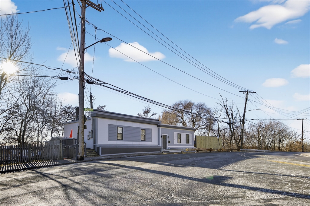 3 Walley Street Boston, MA 02128 - Photo 2 of 11 a view of a house with a snow in the yard