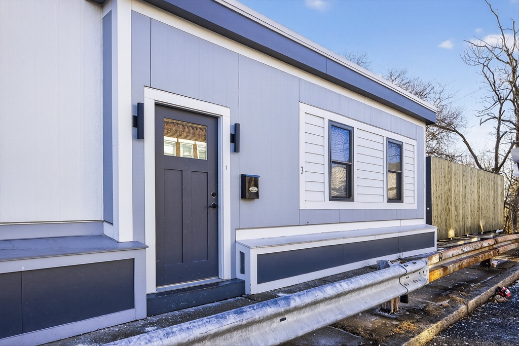 3 Walley Street Boston, MA 02128 - Photo 3 of 11 a view of a door and chair in front of a house