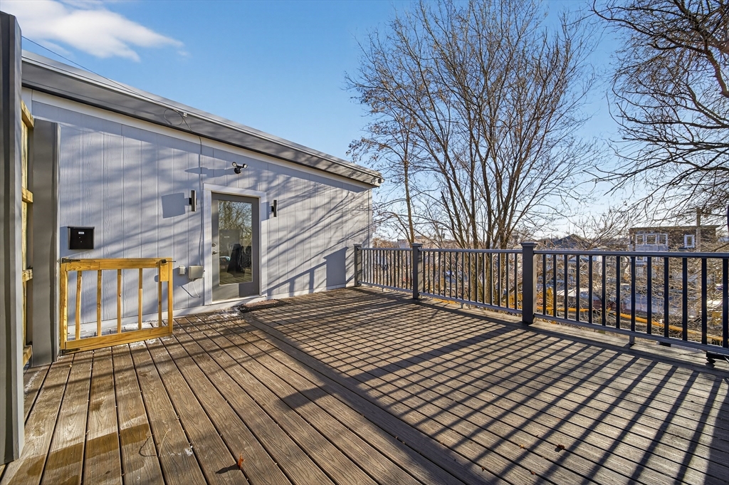 3 Walley Street Boston, MA 02128 - Photo 7 of 11 a view of a wooden deck