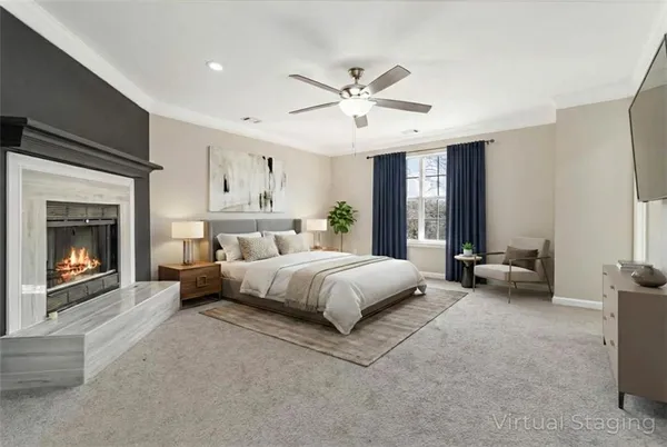 a spacious bedroom with a bed and a fireplace