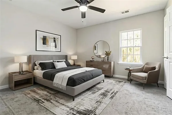 a spacious bedroom with a bed and furniture
