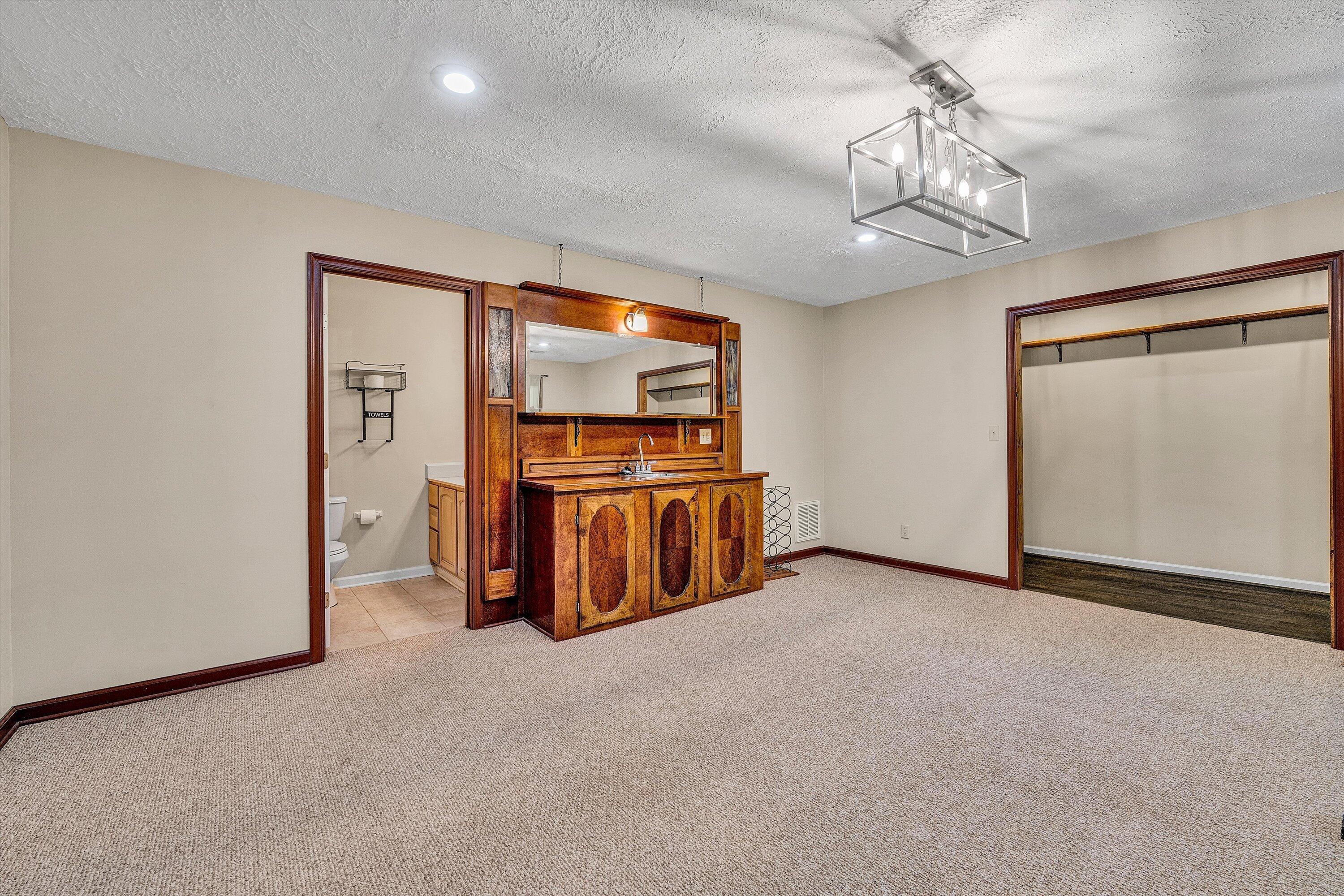 400 Harbor Moneta, VA 24121 - Photo 32 of 51 a view of a room with furniture and chandelier