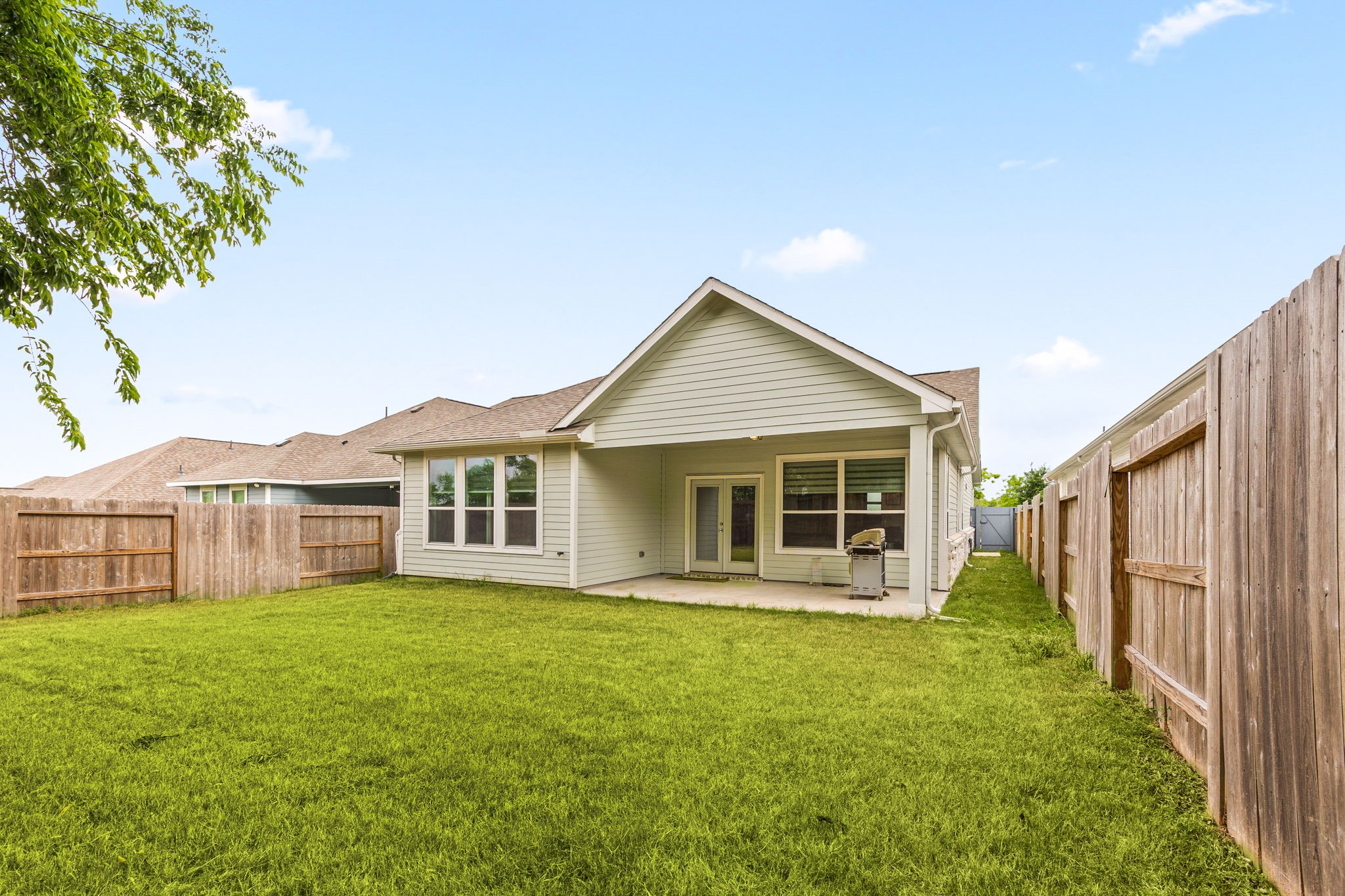 33142 School Hl Road Fulshear, TX 77441 - Photo 26 of 29 a view of a house with a yard and potted plants