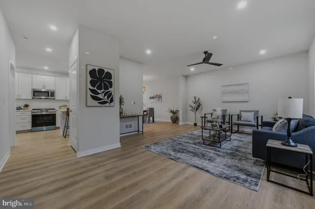 a view of a livingroom with furniture and a flat screen tv