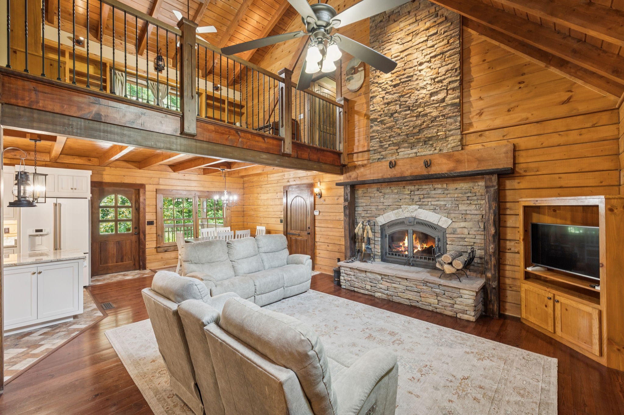 196 Moore Road Westpoint, TN 38486 - Photo 20 of 89 a living room with furniture a flat screen tv and a fireplace