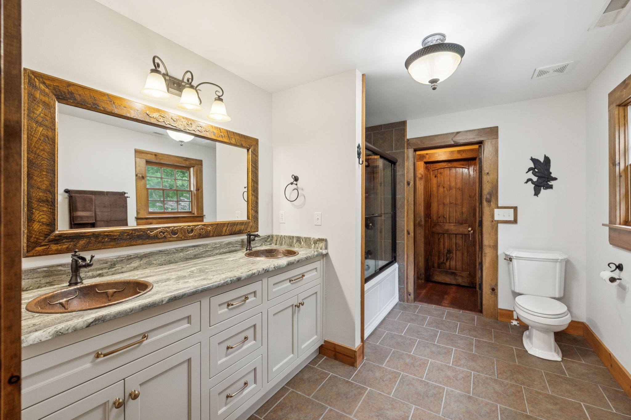 196 Moore Road Westpoint, TN 38486 - Photo 35 of 89 a spacious bathroom with a granite countertop sink a toilet a mirror and shower