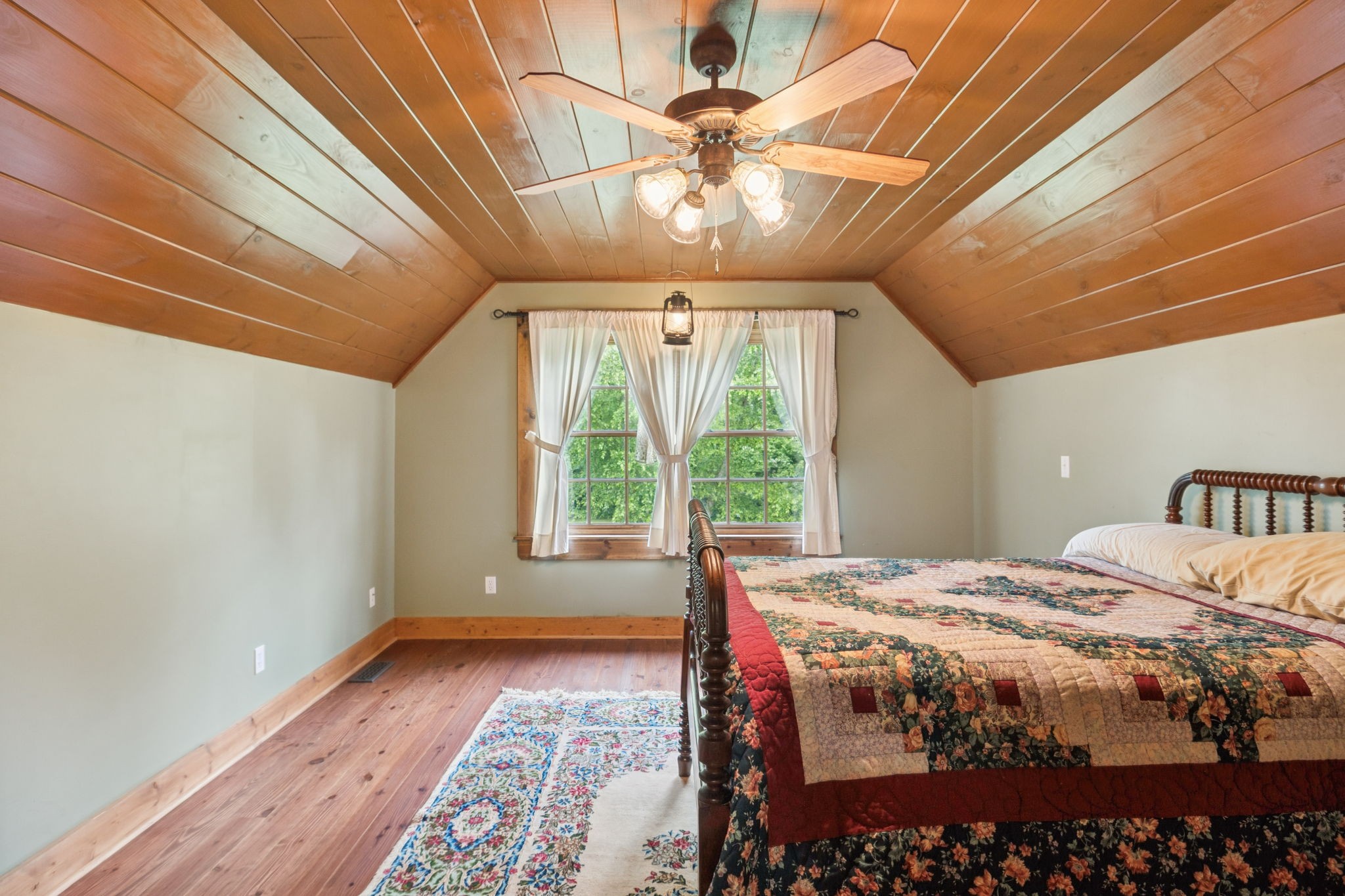 196 Moore Road Westpoint, TN 38486 - Photo 36 of 89 a bedroom with a bed and a chandelier