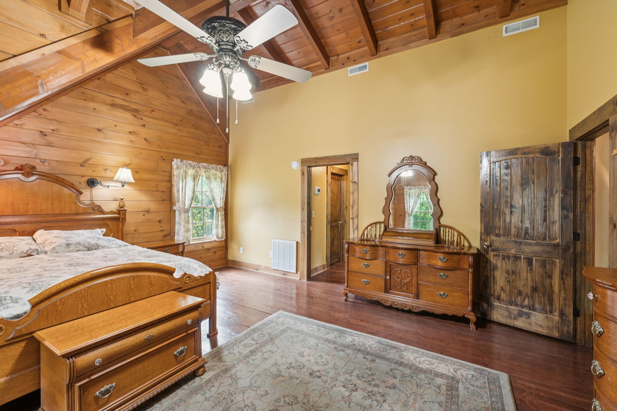 196 Moore Road Westpoint, TN 38486 - Photo 39 of 89 a bed room with a bed and a chandelier