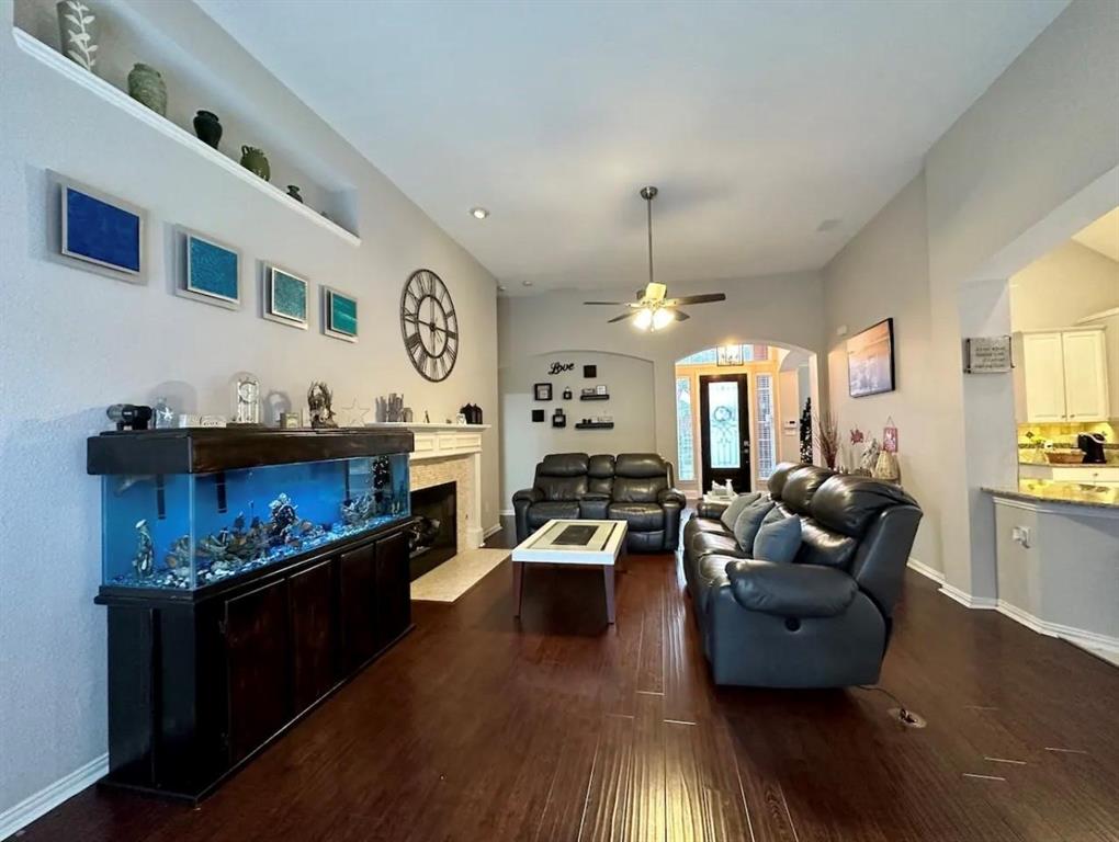 3607 Sable Ridge Drive Dallas, TX 75287 - Photo 3 of 30 a living room with furniture and wooden floor