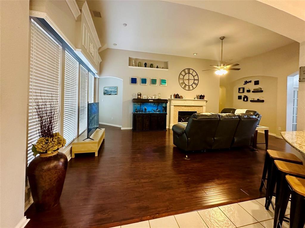 3607 Sable Ridge Drive Dallas, TX 75287 - Photo 5 of 30 a living room with fireplace furniture and a wooden floor