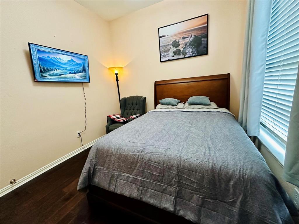 3607 Sable Ridge Drive Dallas, TX 75287 - Photo 7 of 30 a bed sitting in a bedroom next to a window