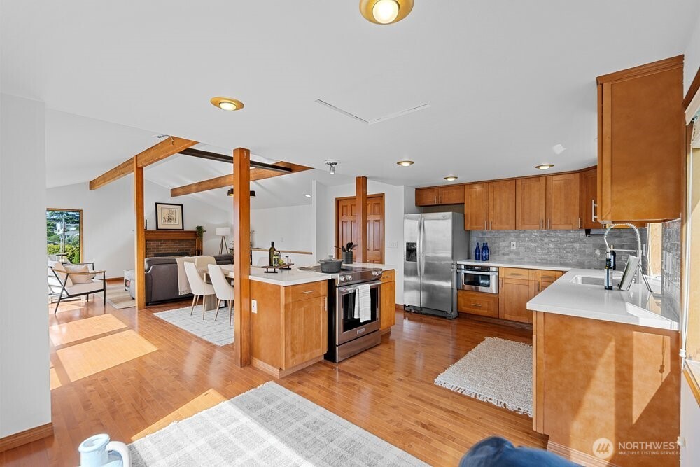 902 7th Avenue South Edmonds, WA 98020 - Photo 14 of 31 a kitchen with stainless steel appliances granite countertop a sink counter space and a view of living room