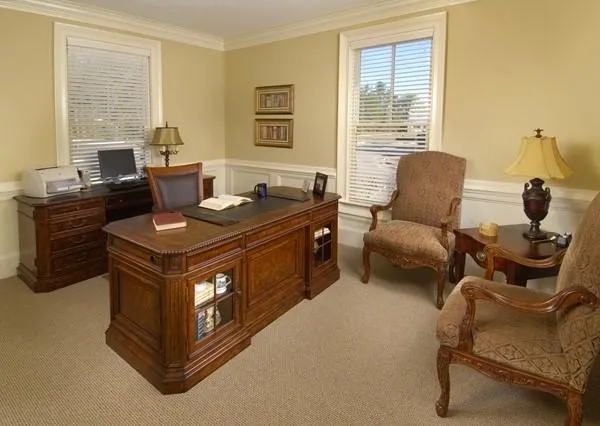 a view of a livingroom with furniture and a window