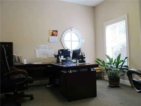 a view of a workspace with furniture