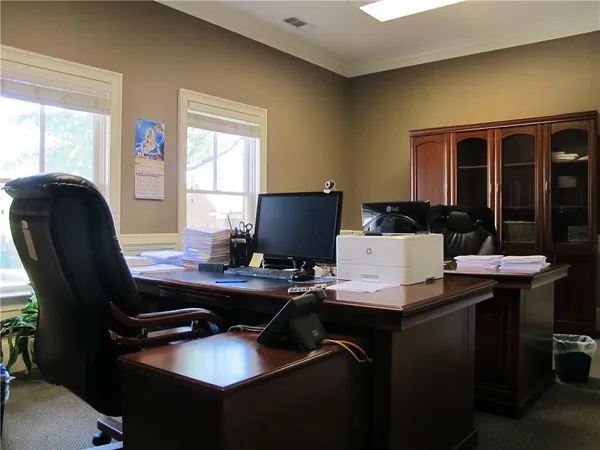 a view of a workspace with furniture