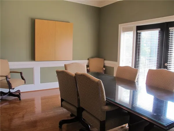 a view of a dining room with furniture window and outside view