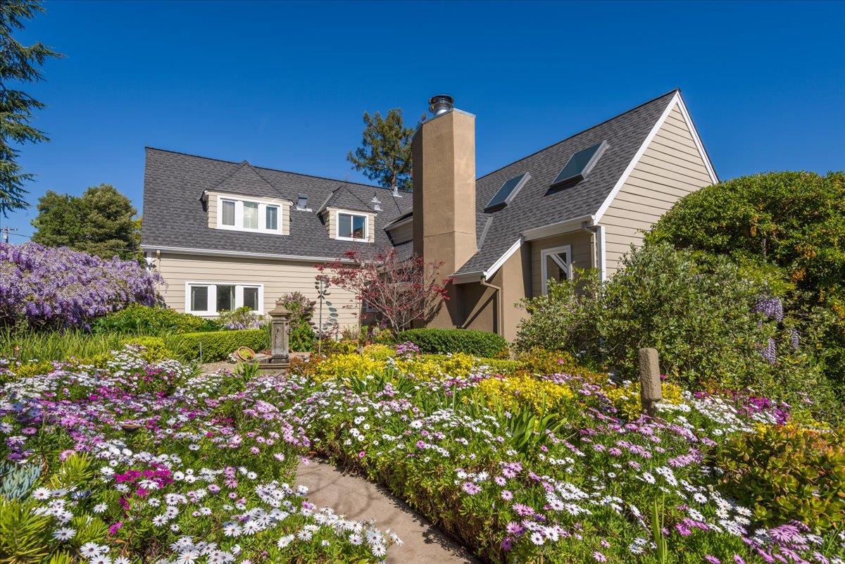 819 Holly Road Belmont, CA 94002 - Photo 1 of 75 a view of a house with a yard and garden