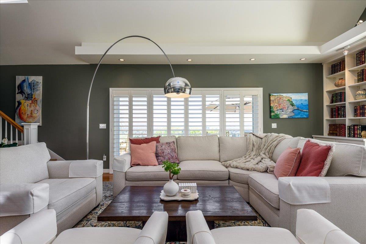 819 Holly Road Belmont, CA 94002 - Photo 19 of 75 a living room with furniture and a large window