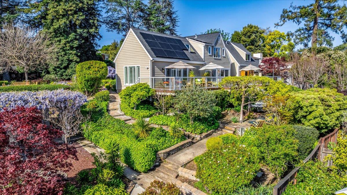 819 Holly Road Belmont, CA 94002 - Photo 2 of 75 a front view of a house with a yard and potted plants