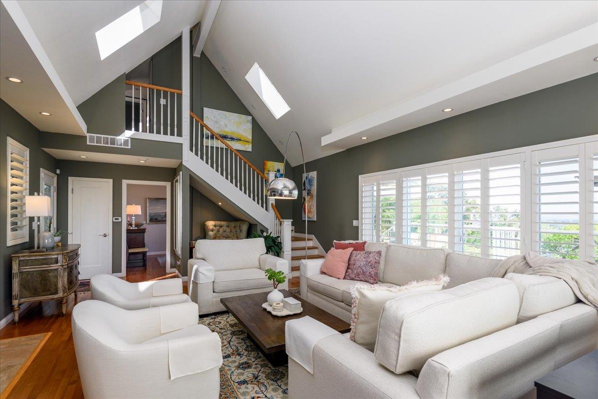 819 Holly Road Belmont, CA 94002 - Photo 21 of 75 a living room with furniture and a large window