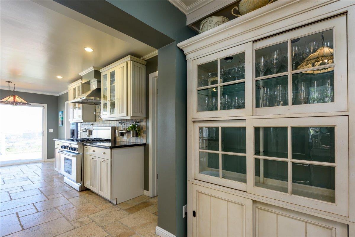 819 Holly Road Belmont, CA 94002 - Photo 27 of 75 a kitchen with stainless steel appliances granite countertop a stove and a refrigerator