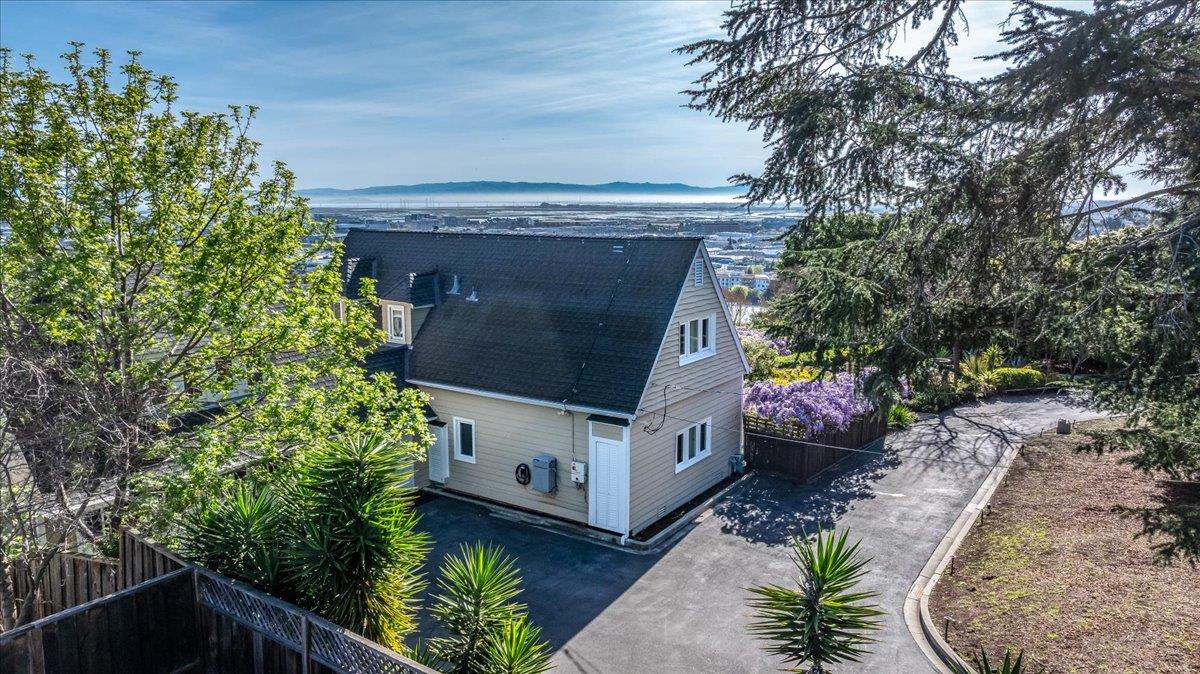 819 Holly Road Belmont, CA 94002 - Photo 3 of 75 a car parked in front of a white house