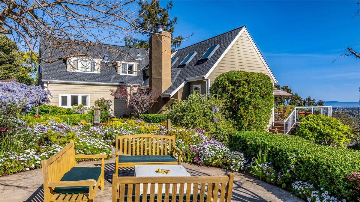 819 Holly Road Belmont, CA 94002 - Photo 4 of 75 a front view of a house with a yard