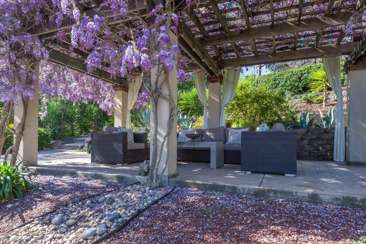 819 Holly Road Belmont, CA 94002 - Photo 51 of 75 a view of a patio with furniture and a backyard