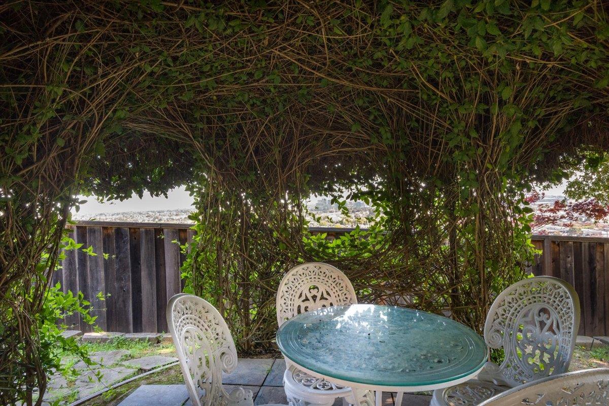 819 Holly Road Belmont, CA 94002 - Photo 57 of 75 a backyard of a house with table and chairs