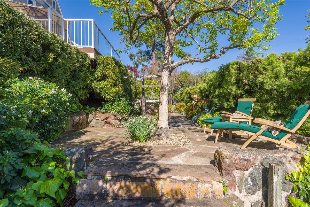 819 Holly Road Belmont, CA 94002 - Photo 59 of 75 a backyard of a house with table and chairs