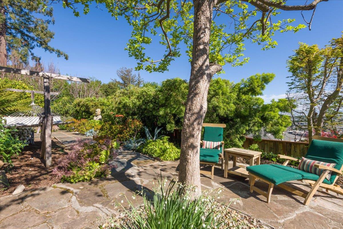 819 Holly Road Belmont, CA 94002 - Photo 60 of 75 a view of a chairs and table in a backyard