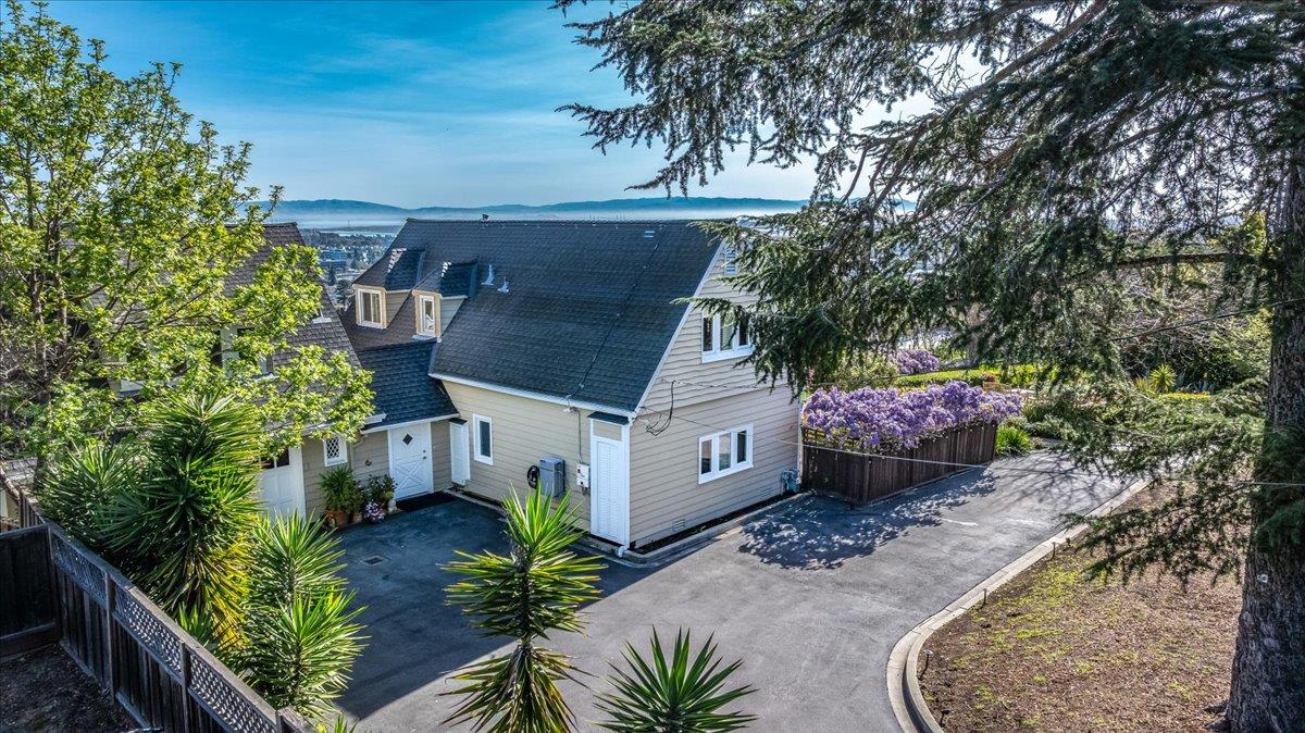 819 Holly Road Belmont, CA 94002 - Photo 6 of 75 a view of a house with a tub and a garden