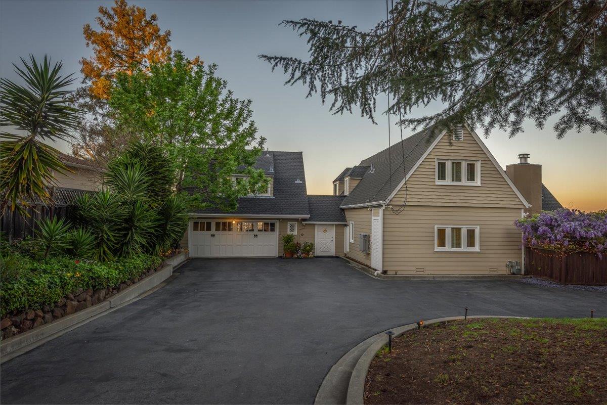 819 Holly Road Belmont, CA 94002 - Photo 63 of 75 a front view of a house with a garden and trees