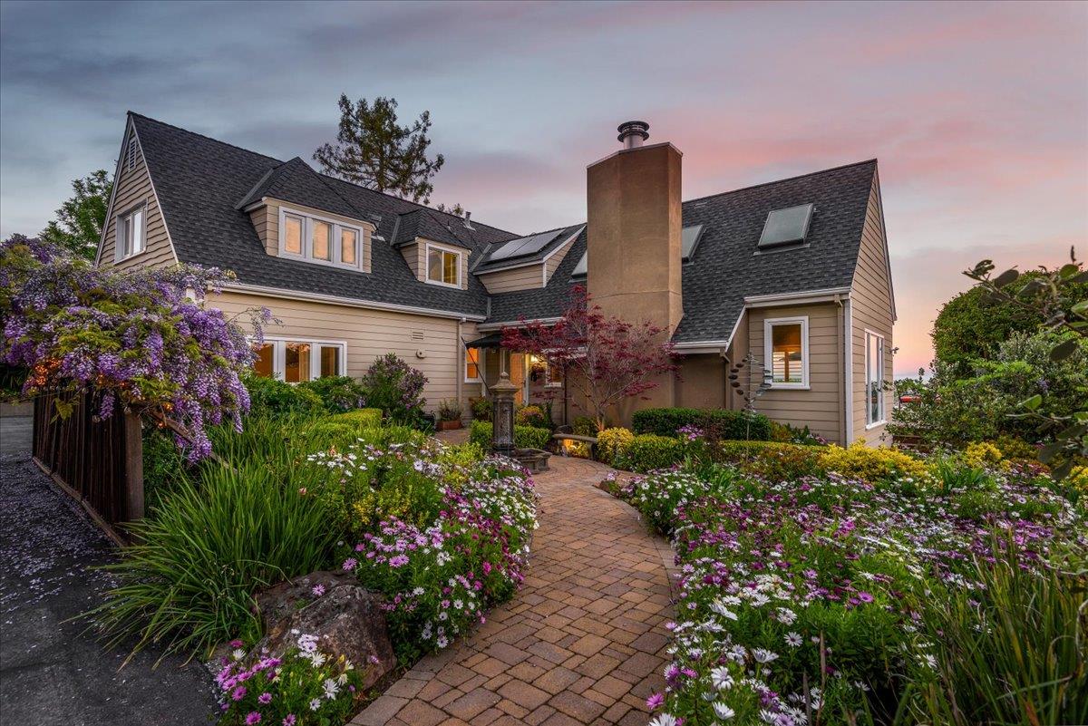 819 Holly Road Belmont, CA 94002 - Photo 65 of 75 a front view of a house with a yard and fountain in middle