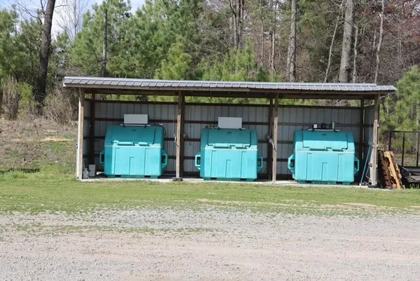a view of a chairs in a backyard