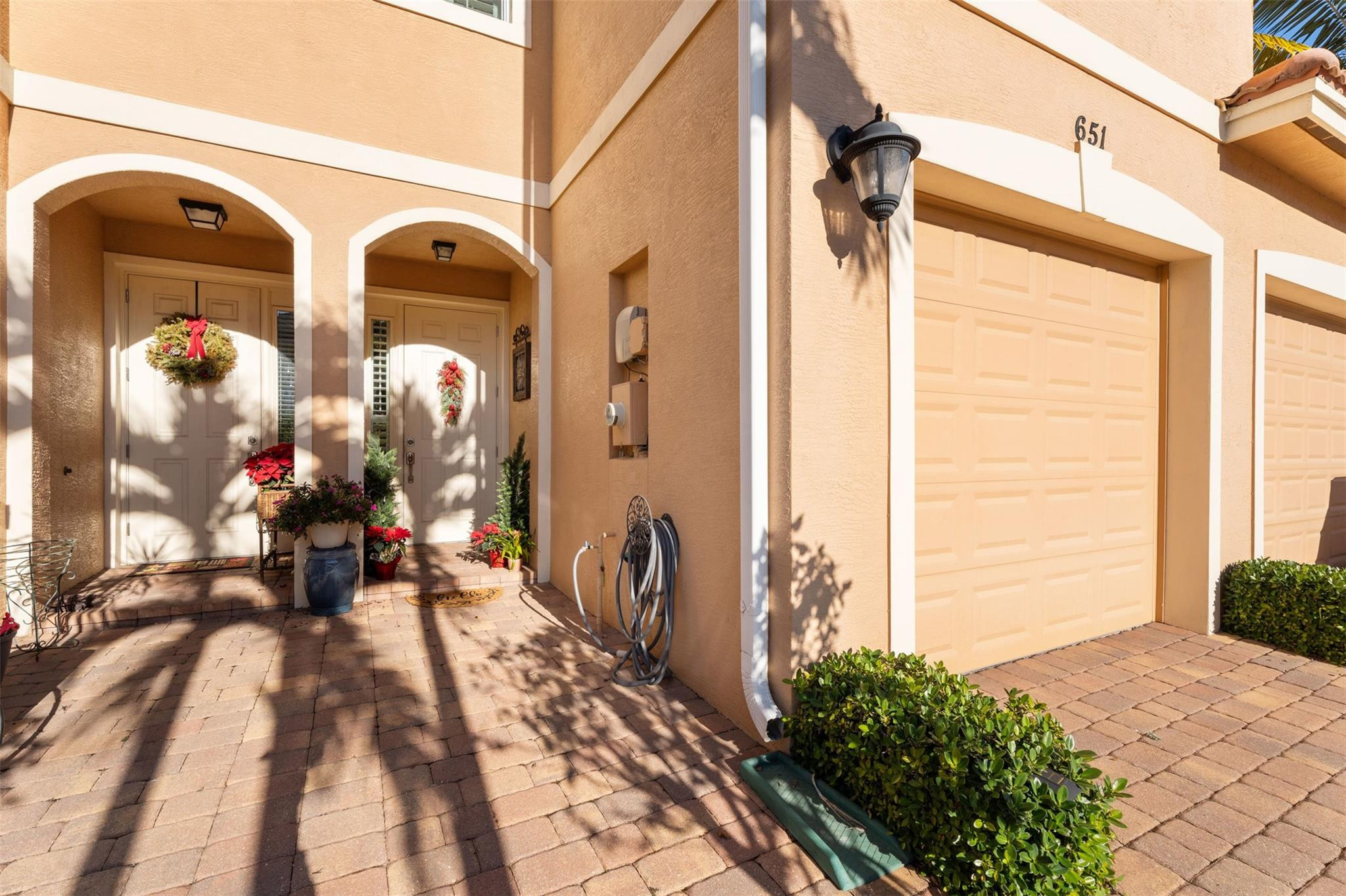 651 Southwest Glen Crest Way, Unit 2 Stuart, FL 34997 - Photo 3 of 41 a front view of a house with a porch