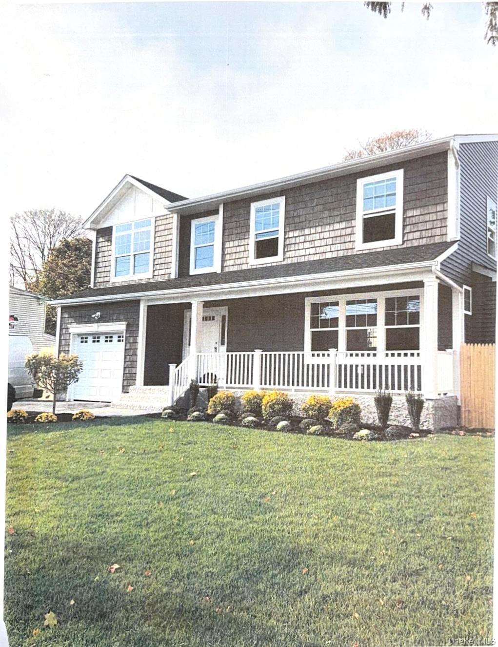190 Country Road Medford, NY 11763 - Photo 1 of 1 a front view of a house with a yard