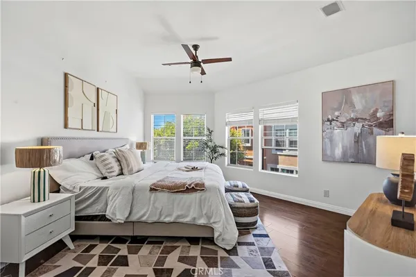 a bathroom with a double vanity sink toilet and shower