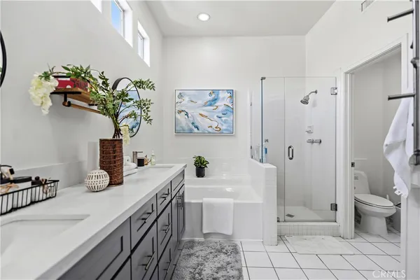 an aerial view of a house with a garden and lake view