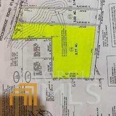 2476 Rockbridge Road Northwest Conyers, GA 30012 - Photo 2 of 3 a bathroom with a mirror