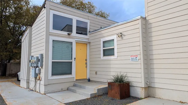 a view of a house with a potted plant