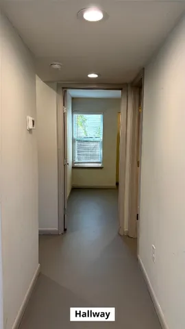 a view of room with a ceiling fan and window