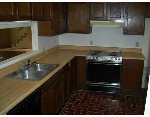 a kitchen with a stove and a microwave